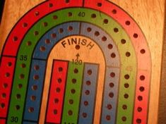 a close up of a wooden board game with numbers and lines on it, as well as the word finish