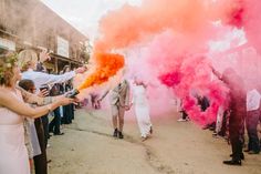 people are throwing colored powder on each other