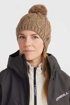 With a chunky knit pattern, a pom-pom and a ribbed cuff, the Nora Beanie makes a cozy addition to your winter looks. | O'Neill Women's Nora Beanie in Concrete Chunky Knitting Patterns, Knit Pattern, Winter Looks, Knit Patterns, Chunky Knit, Pom Pom, Cuff, Van, Knitting