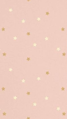 a pink wall with gold stars on it