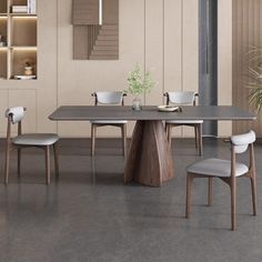 a dining table with four chairs around it in a room that has beige walls and flooring