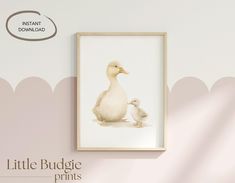 an image of a duck and its baby in a frame on the wall next to it