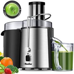 an image of a juicer with fruits and vegetables