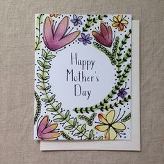 a mother's day card with flowers and leaves