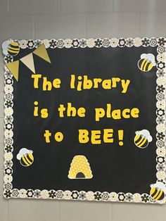 a sign that says the library is the place to bee