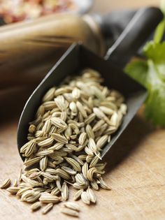 a wooden cutting board topped with lots of seeds