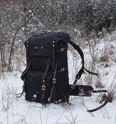 ''The Freefolk Bushcraft Backpack (Single Front), BLACK as Tasmanian Forest Raven''. Handcrafted for adventures or peaceful time in the woods. Everyone who is looking to enter more hardcore weather cons will appreciate the wide top flap - overlapping to the sides as ''knight's shoulder armor''. You can easily fit IN and ON the bag all your gear and supplies needed for weeks in the wilderness. Made of genuine leather, solid brass or stainless steel hardware and quality waxed canvas, Freefolk won' Black Leather Backpack With Canvas Lining, Black Waxed Canvas Backpack, Black Waxed Canvas Standard Backpack, Black Standard Backpack For Adventure, Black Canvas Bag For Adventure, Black Canvas Standard Backpack, Black Leather Backpack For Outdoor, Camping Backpack With Adjustable Strap, Standard Camping Backpack With Adjustable Strap