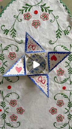 an origami bird on a table cloth