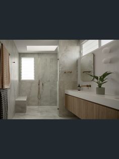 a bathroom with a sink, toilet and shower stall in it's own area