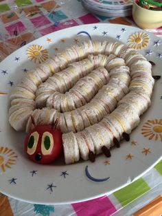 a very cute looking caterpillar on a plate