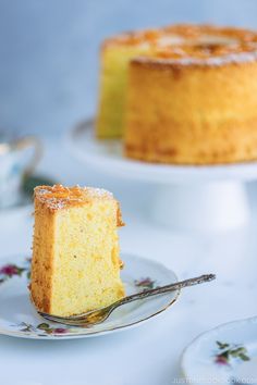 a piece of cake on a plate with a fork in front of it and another slice missing