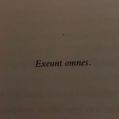 the words are written in cursive writing on a piece of white paper that says, excent omnes