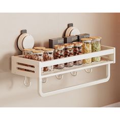 a shelf filled with lots of food on top of a wall