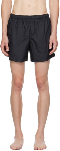 Packable relaxed-fit nylon taffeta swim shorts. Includes drawstring pouch. · Concealed drawstring at elasticized waistband · Two-pocket styling · Coin pocket at inner waistband · Briefs-style mesh lining Supplier color: Black Black Nylon Swim Trunks With Drawstring, Black Moisture-wicking Relaxed Fit Swim Trunks, Nylon Swim Trunks With Built-in Shorts For Water Sports, Functional Nylon Swim Trunks With 4-way Stretch, Black Nylon Swim Trunks, Short Length, Black Drapes, Our Legacy, Black Body, Drawstring Pouch