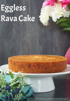 an eggless cake on a plate with flowers in the background and text overlay