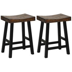 two wooden stools sitting next to each other