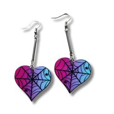 Embrace the perfect blend of whimsy and elegance with our heart-shaped spider web earrings. These enchanting earrings measure a striking 3 inches in length, making them a standout addition to any jewelry collection. Crafted from high-quality acrylic, each double-sided earring features an intricate spider web pattern with little spiders in a charming heart shape. The acrylic material ensures a lightweight feel while maintaining durability, making these earrings comfortable for all-day wear.   These beautiful hombre colors of pink, purple and blue make the black spider web standout and a silver tone connector bar brings it all together. Add a touch of enchanting elegance to your collection with our heart-shaped spider web earrings. Order now and let your style shine with a hint of gothic rom Halloween Party Heart-shaped Earrings, Heart-shaped Halloween Party Earrings, Multicolor Halloween Earrings For Gift, Multicolor Halloween Earrings Gift, Gothic Dangle Heart Earrings For Gift, Bright Halloween, Spider Web Earrings, Halloween Heart, Pride Jewelry