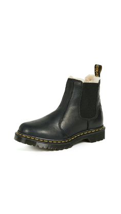 PRICES MAY VARY. Constructed for comfort on the iconic Dr. Martens air-cushioned sole This boot is Goodyear-welted, meaning the upper and sole are sewn together in our heat-sealed z-welt stitch. Good abrasion and slip resistance Lined with warm faux fur Retains essential Doc DNA, like yellow stitching, grooved sides, and heel loop A leather with a subtle grain and oily surface - burnished to darken the toe and counter area. Dr Martens Leonore, How To Wear Ankle Boots, Doc Martens Outfit, Botas Chelsea, Fur Lined Boots, Womens Ankle Boots, Chelsea Boot, Doc Martens, Wyoming