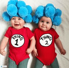 two babies wearing thing 1 and thing 2 shirts