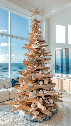 a christmas tree made out of driftwood and seashells in a living room