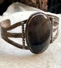 Beautiful 1940s Navajo Sterling Silver Petrified Wood Native American Vintage Cuff Bracelet Face of the stone measures over 1 3/4 inches tall I have left its natural patina but would polish up nicely weighs 40 grams Brown Rustic Jewelry With Patina, Rustic Brown Patina Jewelry, Vintage Brown Engraved Cuff Bracelet, Antique Adjustable Brown Jewelry, Adjustable Antique Brown Jewelry, Handmade Vintage Brown Jewelry, Vintage Engraved Brown Jewelry, Vintage Brown Engraved Jewelry, Adjustable Antique Concho Jewelry