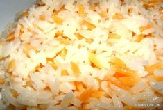 rice and carrots are mixed together in a bowl