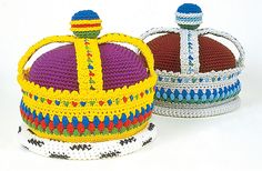 two crocheted crowns sitting next to each other