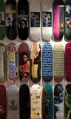 many skateboards are lined up on the wall