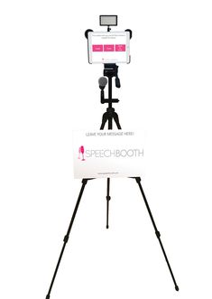 a tripod with a camera attached to it and a sign that says speech booth