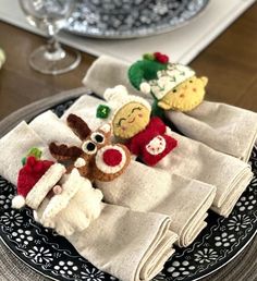 a plate topped with napkins covered in stuffed animals