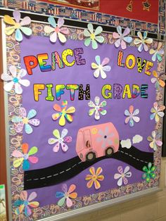 a bulletin board that says peace love fifth grade with flowers and butterflies on the front