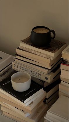 a stack of books and a bowl on top of each other