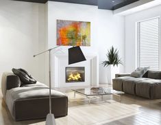 a modern living room with white walls and wood flooring, large painting on the wall