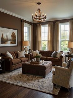 a living room filled with furniture and a chandelier