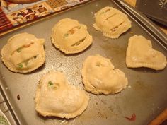 six pastries on a baking sheet ready to go in the oven