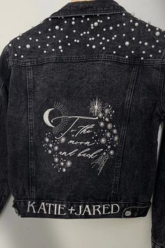 the back of a jean jacket with sequins and stars on it, that says kate jared