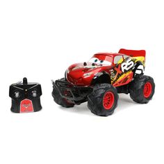 a red monster truck next to a remote control car