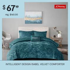 a bed with blue comforter and pillows on it in a room that is advertised for $ 699