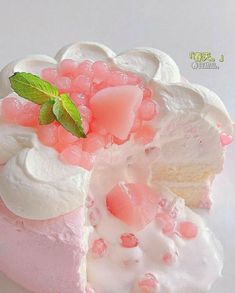 a piece of cake with white frosting and pink icing