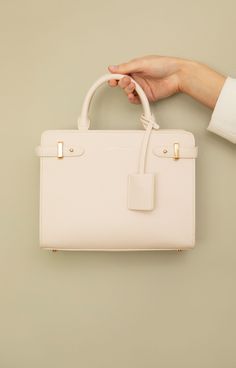 Introducing our new and exclusive occasion handbag. Made from high quality vegan leather and available in three classic shades, this is a timeless, luxury accessory you will want by your side, season after season. Crafted with meticulous attention to detail, the Derby handbag is neat and compact. Its subtly textured exterior is hardwearing with clean lines, so you can rely on adding a polished finish to your outfit every time. Inside is everything you should expect from an elegant and clever fun High-end Beige Handheld Box Bag, Luxury Handheld Box Bag, High-end Beige Satchel Box Bag, High-end Beige Box Bag With Top Handle, High-end Beige Top Handle Box Bag, Luxury Beige Handheld Box Bag, Luxury Handheld Beige Box Bag, Luxury Beige Box Bag With Top Carry Handle, High-end Beige Box Bag With Removable Pouch