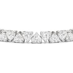 The eternal classic charts a new course with this north-south diamond tennis bracelet. Heart-shaped diamonds secured by v-prongs line up in alternating north-south settings, with the heart's pointed tip alternately pointing up and down. The shift creates a chic and modern appearance while maintaining an air of timelessness. Diamond Tennis Bracelet With Heart Cut For Anniversary, Diamond Heart Cut Tennis Bracelet For Anniversary, Classic Heart Cut Tennis Bracelet For Anniversary, Heart Cut Diamond Tennis Bracelet For Anniversary, Heart Cut Diamond Tennis Bracelet With Diamond Accents, Heart Cut Diamond Tennis Bracelet With Accents, Diamond Heart Cut Tennis Bracelet With Brilliant Cut, White Gold Heart Cut Tennis Bracelet For Anniversary, Luxury Heart Cut Cubic Zirconia Tennis Bracelet