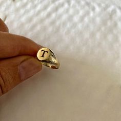 "Pinky ring, 14K solid gold ring. delicate, dainty and light Can be Engraved with letter, Initials in any language ✔ Made to Order ✔ Gold K: 14K ✔ Metal stamp: 14K ✔ Gold Color: Yellow Gold ✔ Ring size: Available in all ring sizes ✔ Face of the ring: 7mm ✔ Gold weight: 1.6 gram * ✔ Ready to Ship in 3-5 Business Days * The gold weight is for a 14k ring. A small difference that might occur depending on the size. Choose your size , and your word / name - in any language let me know in the \"note to Gold Heirloom Initial Ring With Open Design, 14k Gold Open Initial Ring In Yellow Gold, Personalized Initial Ring In 14k Gold With Round Band, 14k Gold Engraved Ring With Initials, Delicate Gold Round Signet Ring, Personalized 14k Gold Initial Ring With Round Band, Dainty Sterling Silver Initial Ring Stamped 14k, Gold Heirloom Open Initial Ring, Dainty Engraved Ring With Initials For Promise