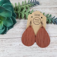 "These trendy small cinnamon brown suede teardrop petal leather earrings make a great statement, yet simple and easy for everyday wear.  They feature a textured vertical line pattern and are super soft, lightweight and are sure to pair perfectly with any outfit!  They also make great gifts for moms, daughters, grandmothers, sisters, friends, teachers, coworkers, and more! *Size = Length 2\" x 1.25\" wide with a drop of 2.5\" *Hardware = antique bronze *Thickness = 1.0mm = average* > Durable > Noise free > Affordable > Nickel free fishhook ear wire > Rubber backs included so you can wear them without losing one! I have a variety of colors and styles to choose from so be sure to view my other listings: https://www.etsy.com/shop/BethWolfHandmade All items are made and ready to ship! --------- Brown Teardrop Earrings With Ear Wire, Adjustable Brown Teardrop Earrings, Handmade Brown Teardrop Dangle Earrings, Everyday Brown Teardrop Earrings, Trendy Brown Teardrop Earrings, Cinnamon Brown, Great Gifts For Mom, Drop Earring, Line Patterns