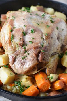 a pot roast with potatoes, carrots and meat