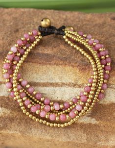 Thailand's Tiraphan Hasub celebrates rose joy with this opulent bracelet. She crafts the bracelet by hand, combining dyed pink quartz, that represents April´s birthstone, and gleaming brass beads. Brass bells form the clasp. Homemade Necklaces, Jewlery Necklace, Beaded Jewelry Bracelets, Beads Craft Jewelry, Bracelets Beaded, Diy Jewelry Necklace, Beaded Necklace Designs, Beaded Necklace Diy, Beads Bracelet Design