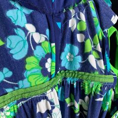 "1970s vintage dress from Lord and Taylor's in a gorgeous blue green floral polyester double knit with bright green piping around the waist, armholes and neck. Features a keyhole back with neck tie and zipper closure. Size 10 Bust: 36-38\" Waist: 28\" Hips: 44\" Length: 42\" Excellent condition no issues. Arrives clean ready to wear. Sale supports Vermont's PuppeTree. Thank you & please check our Etsy Support Store for many more vintage dresses." 1970s Style Blue Floral Print Dresses, Modest Skirts, Green Butterfly, Taylor Dress, Green Flower, Double Knit, Polyester Dress, Double Knitting, Vintage Dress