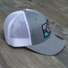 Let’s face it. You’re ready to turn this hat back and get lost like Tom Hanks and Wilson on a deserted island. Well maybe that’s a bit extreme but we’re picking up what you’re throwing down. SPECS: Color: Heather Grey Front With White Mesh Fit & Size: MidCrown / Precurved Visor / Adjustable Snapback Material: 65% Polyester / 35% Cotton Cheap Gray Snapback Hats, Adjustable White Hats For Camping, Adjustable White Hat For Camping, Adjustable Gray Baseball Cap For The Beach, Adjustable Gray Baseball Cap For Beach, Gray Curved Brim Hat For Camping, Casual Gray Hat For Camping, White Baseball Cap For Camping, Gray Adjustable Hat For Camping