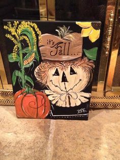 a painting of a pumpkin with a hat on it