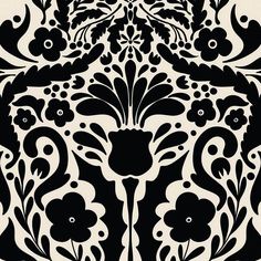 an ornate black and white pattern with flowers