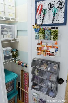 an image of a craft room with scissors and other items on the door shelfs